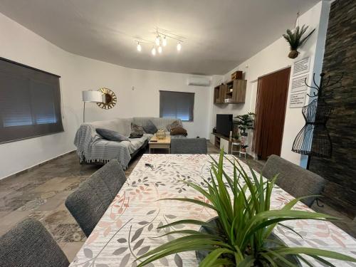 a living room with a couch and a table at La casa de las nieves in Hondón de las Nieves