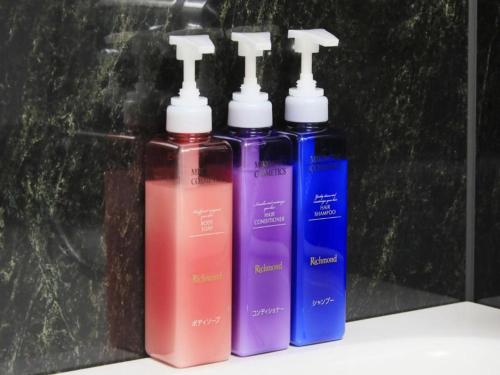 a group of three different colored bottles on a shelf at Richmond Hotel Morioka Ekimae in Morioka