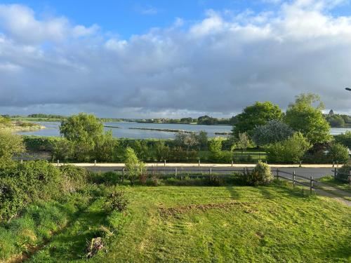 a view of a body of water from a park at Chambre chez l'habitant in Séné