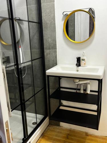 a bathroom with a sink and a shower at TasEV Guesthouse in North Nicosia