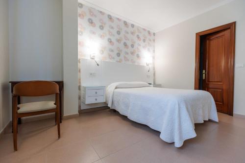 Letto o letti in una camera di Hotel O Cruceiro