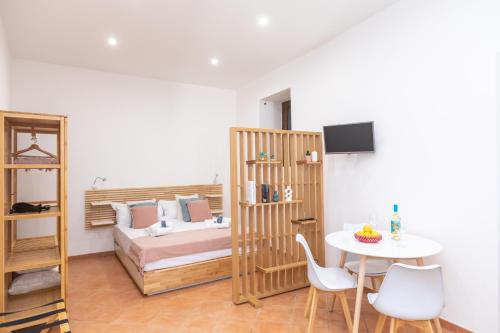 En eller flere senge i et værelse på Domus 116 Ortigia by Ortigiaapartments