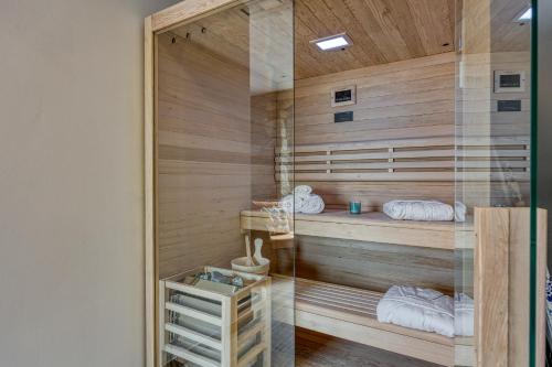 a sauna with wood paneling and a glass wall at Casa Emilia in Sveti Donat in Buzet