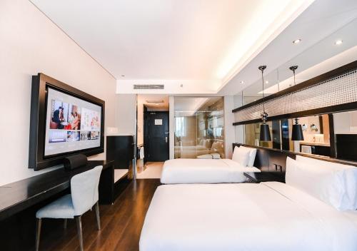 Rúm í herbergi á Crystal Orange Hotel Shanghai Kangqiao Branch