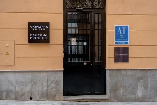 a black door on the side of a building at Suites Campo del Príncipe by Maxi Hoteles in Granada