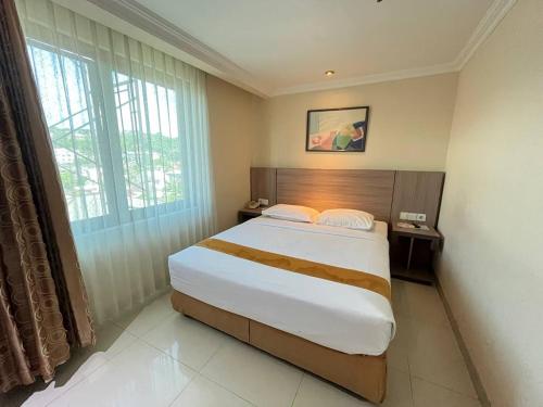 Postel nebo postele na pokoji v ubytování Manise Hotel