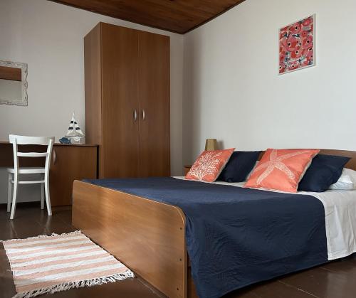 Postel nebo postele na pokoji v ubytování Apartmani Ruvo 1