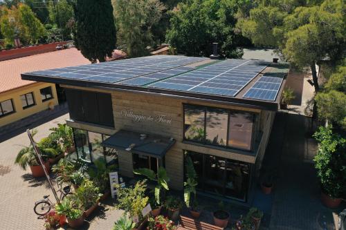 an overhead view of a house with solar panels on the roof at Villaggio Dei Fiori in Sanremo