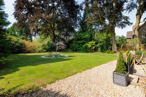 a garden with a park with a playground in it at Stunning 1bed flat in Hale, Cheshire in Hale