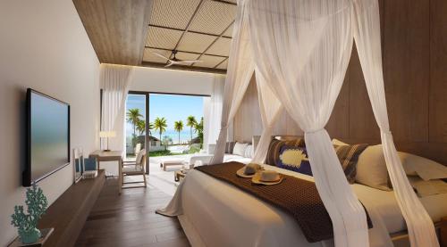a bedroom with a canopy bed with a view of the ocean at Irene Resort Koh Lipe in Ko Lipe