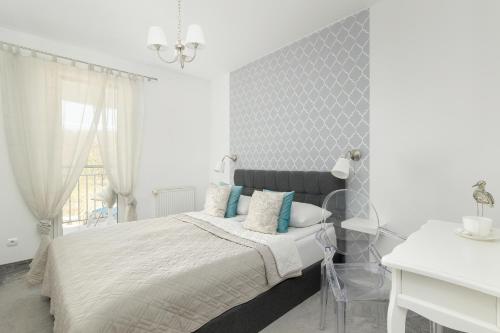 Posteľ alebo postele v izbe v ubytovaní Jasnoszary Apartament Sun Seasons 24 w Kołobrzegu Blisko Morza by Noclegi Renters