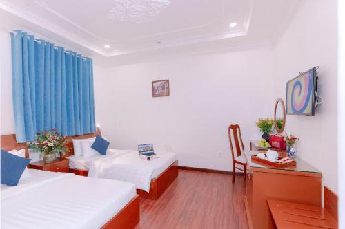 DAHLIALAND SAIGON HOTEL & SWIMMING PooLにあるベッド
