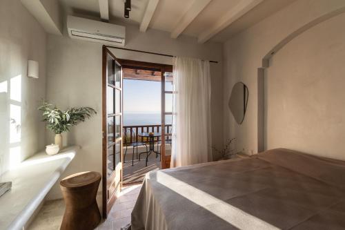 Postel nebo postele na pokoji v ubytování Om Living Pelion