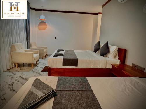 M'pai Bay Hotelにあるベッド