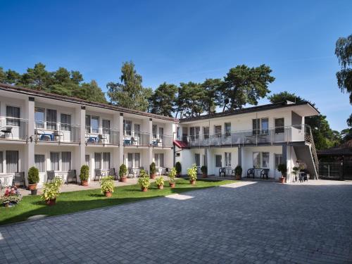 an image of the courtyard of a hotel at Caro - Blisko Morza Łeba in Łeba