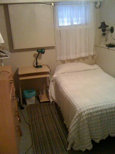 Postel nebo postele na pokoji v ubytování Mining Rooms Gaspé Murdochville