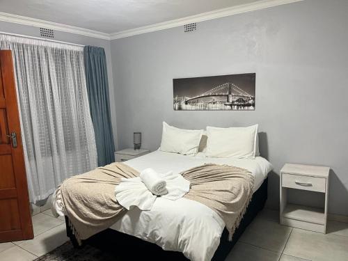 Ένα ή περισσότερα κρεβάτια σε δωμάτιο στο Mogoma Guesthouse