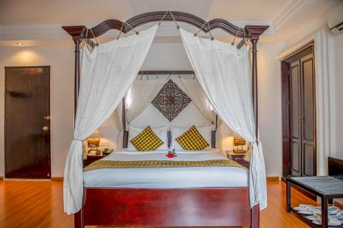 Ένα ή περισσότερα κρεβάτια σε δωμάτιο στο La Rose Suites
