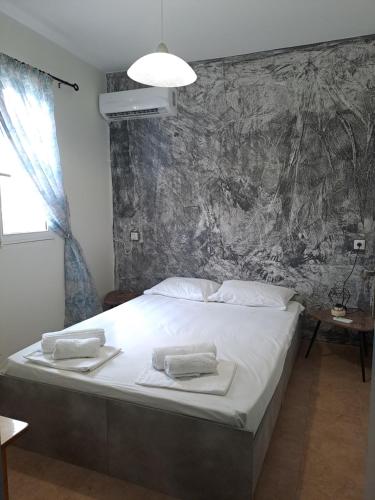 Ένα ή περισσότερα κρεβάτια σε δωμάτιο στο Elafonisos Guesthouse