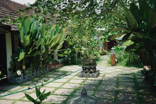 a garden with a bunch of plants and a fence at Hotel Holiday Home in Kovalam