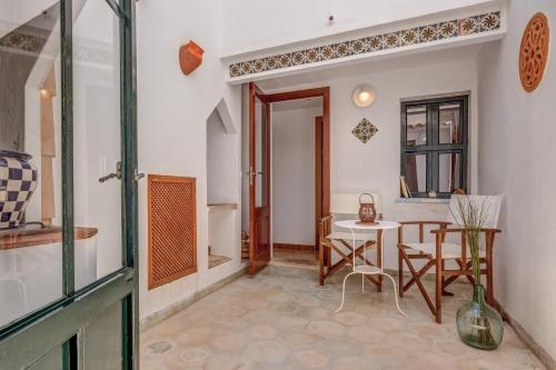 a living room with a table and a dining room at Sweet Family House in Cala d´Or