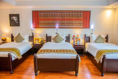Ένα ή περισσότερα κρεβάτια σε δωμάτιο στο La Rose Suites