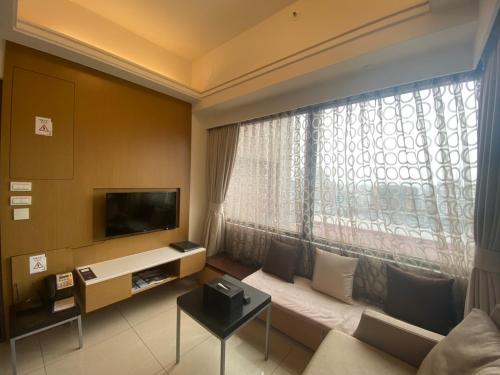TV a/nebo společenská místnost v ubytování AJ Residence 安捷國際公寓酒店