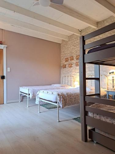 a bedroom with a bed in a room at "Les Tournesols" piscine, campagne, idéal familles in Sauveterre