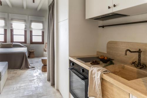 a kitchen with a sink and a counter top at Om Living Pelion in Agios Dimitrios