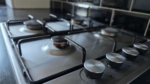 a stove top with a bunch of knobs on it at The Ansi9 in Livingston
