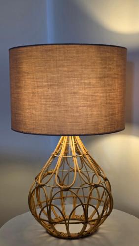 a brown lamp with a brown shade on a table at The Ansi9 in Livingston
