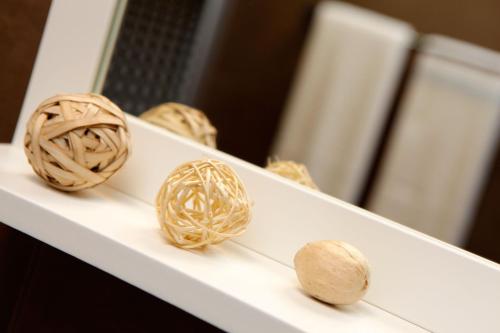 a group of balls on a white shelf at Vacation Home Villa Oleandra in Bol