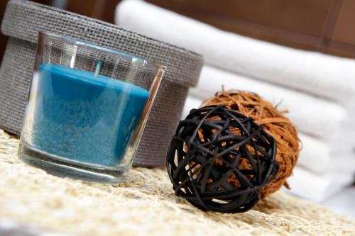 a candle and a ball of rope on a table at Vacation Home Villa Oleandra in Bol