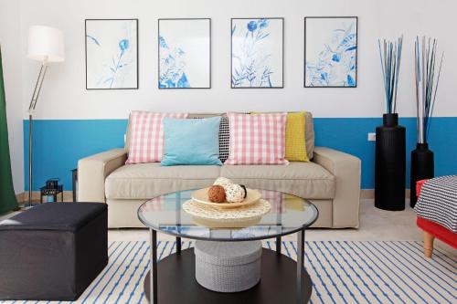 a living room with a couch and a glass table at Vacation Home Villa Oleandra in Bol