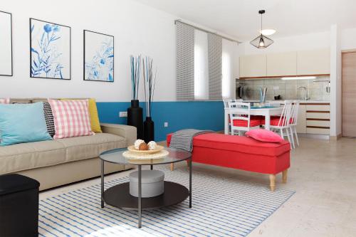 a living room with a couch and a table at Vacation Home Villa Oleandra in Bol