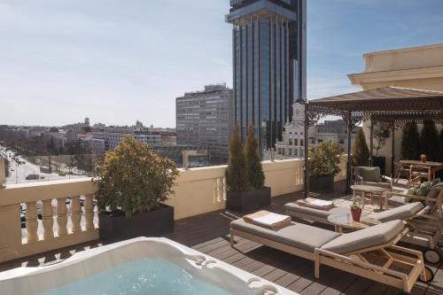 a balcony with a hot tub on a building at Hotel Fenix Gran Meliá - The Leading Hotels of the World in Madrid