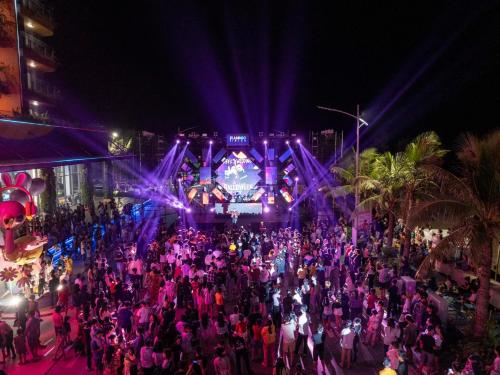 a large crowd of people standing in front of a building at Flamingo Hai Tien in Nam Khê