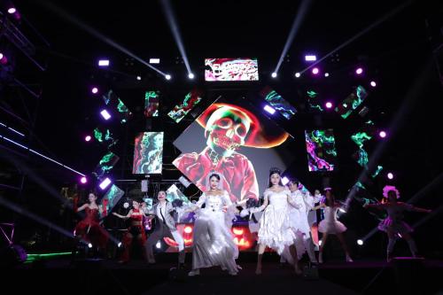 a group of people standing in front of a stage at Flamingo Hai Tien in Nam Khê