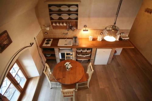 an overhead view of a kitchen with a table and chairs at Apartmány Reve in Třeboň
