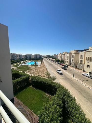 a view of a street from a balcony of a building at امواج الساحل الشمالى الساحل الشرير in Marsa Matruh