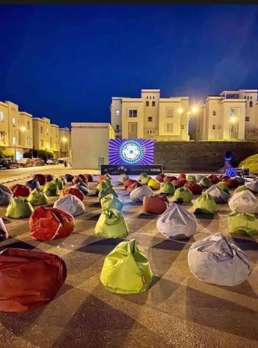a group of bags on the ground in front of a building at امواج الساحل الشمالى الساحل الشرير in Marsa Matruh