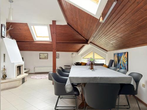 a dining room with a table and chairs at Corner house apartment in Montana