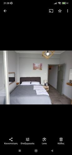 a picture of a bedroom with a large bed at Ervis Aparment in Agioi Theodoroi