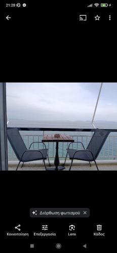 a view of a table and chairs on a balcony at Ervis Aparment in Agioi Theodoroi