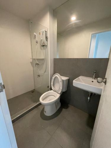a bathroom with a shower and a toilet and a sink at Cozy Stay! Near Chatuchak Market 816 in Bangkok