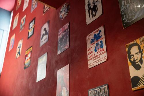a wall with lots of stickers on it at The Music Suites in Bruges