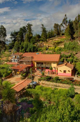 an aerial view of a house on a hill at Finca La Tobita Eco Hotel in Toca