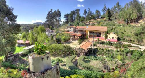 a house on a hill with a garden at Finca La Tobita Eco Hotel in Toca