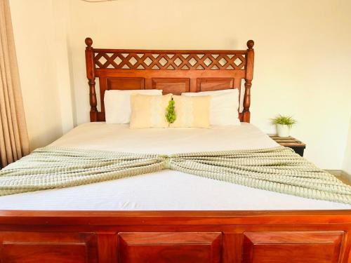 Postel nebo postele na pokoji v ubytování Bamboo House Home Stay Galle