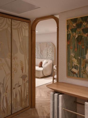 a living room with a sliding glass door with a couch at Soleil Nile Cruise - Every Monday from Luxor for 4 & 7 Nights, and every Friday from Aswan for 3 & 7 Nights in Luxor